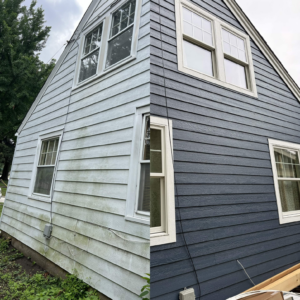 Before and after view of the front exterior showing new blue siding and an updated bay window with white trim.