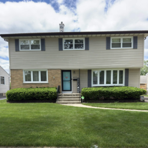 Newly installed replacement windows on a two-story home in Lombard, Illinois.